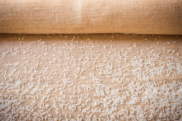 Rice on sackcloth use for background — Stock Photo, Image