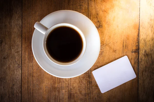 Cartão em branco com xícara de café — Fotografia de Stock