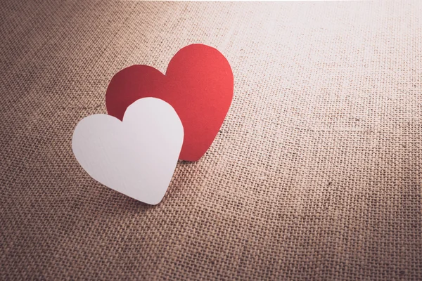 Red hearts symbol on fabric sack surface — Stock Photo, Image