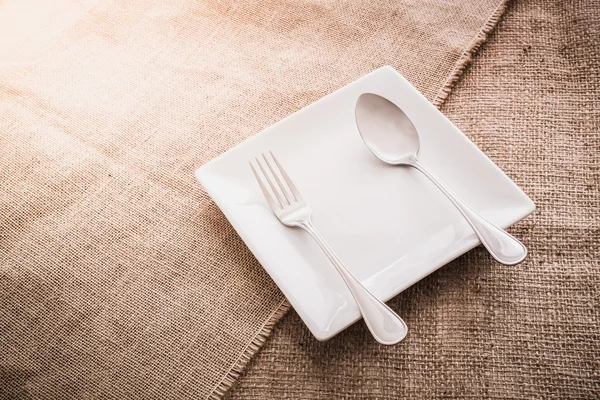 Empty white plate and  spoon, fork — Stock Photo, Image