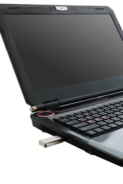 Flash memory drive plugged into a laptop port. — Stock Photo, Image