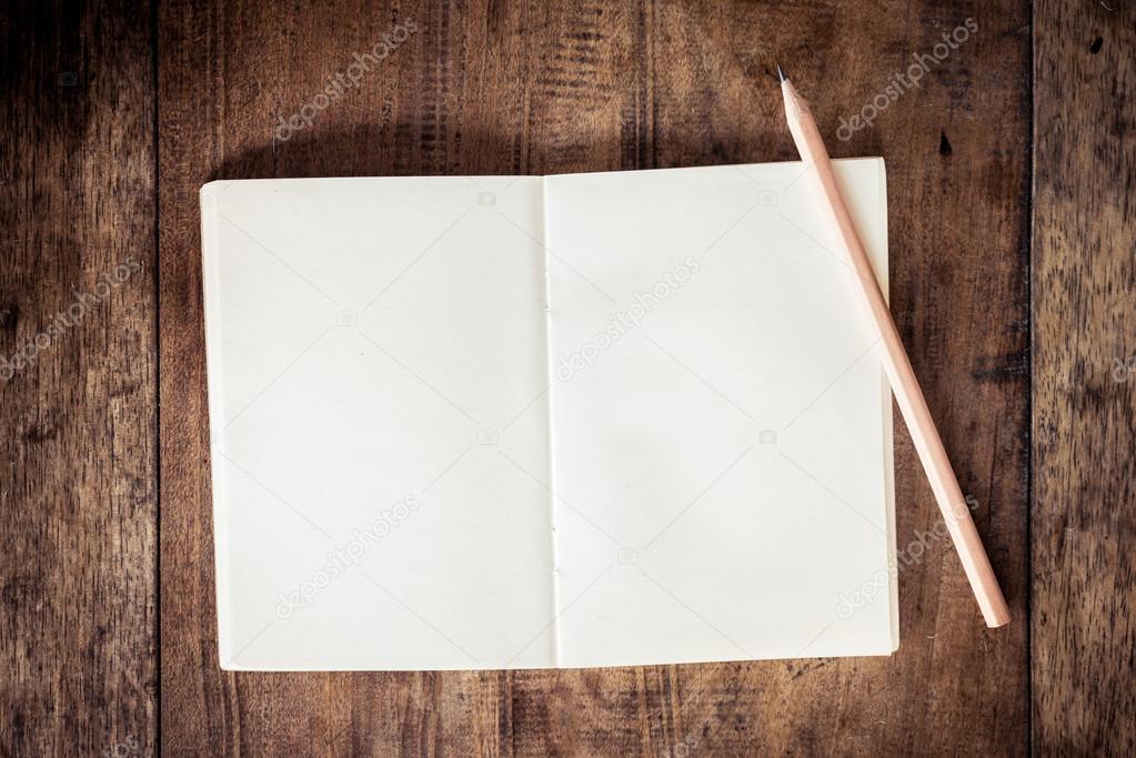 Blank notebook with pencil
