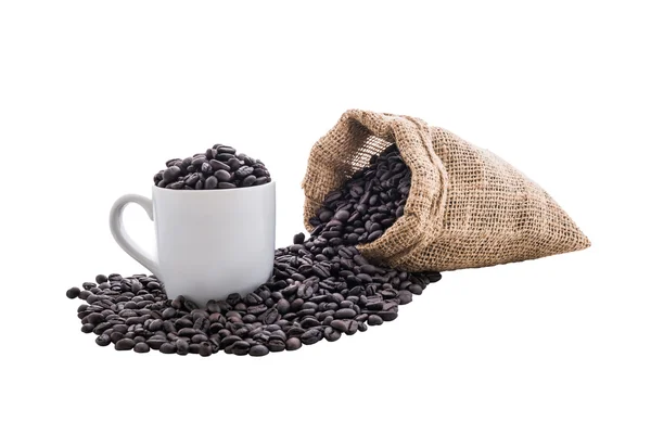 Kávová zrna v sáčku a bílou kávu — Stock fotografie