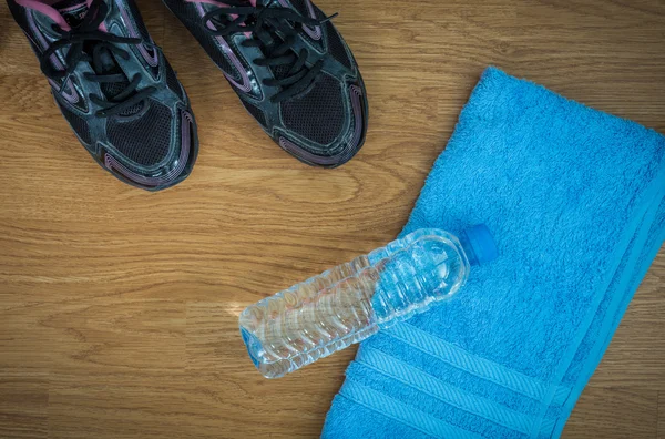 Sport equipment. Sneakers, water, towel — Stock Photo, Image