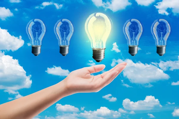 Ideas bulb light on a hand — Stock Photo, Image