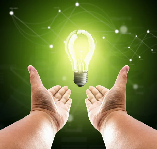 Bulb light on two hand of man — Stock Photo, Image