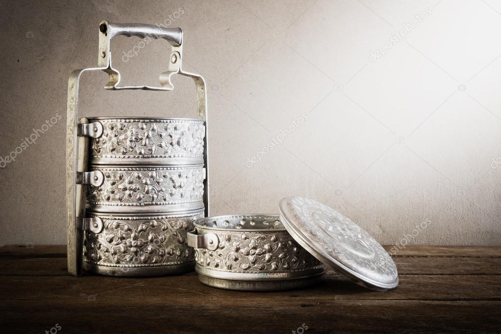 metal Tiffin carrier, thai food carrier on wooden table backgrou