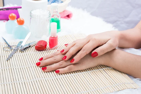 Beautiful manicured woman's nails with red nail polish — Stock Photo, Image
