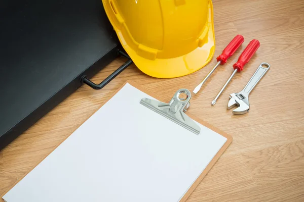 Yellow Safety Helmet Hat and clipboard — Stock Photo, Image