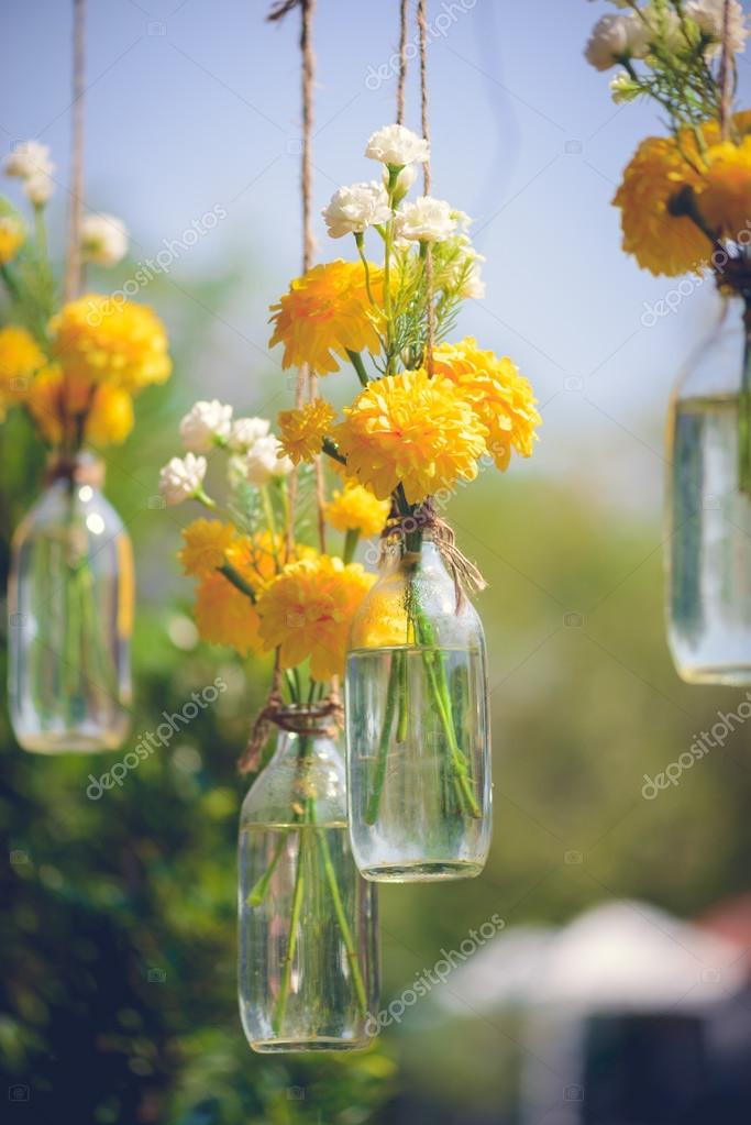 The Marigold Flowers In A Gl Bottle Hanging Stock Photo The Marigold Flowers In A Gl Bottle Hanging Flower Vase Arrangements Vintage Tone Colour Photo By Sirastockid08