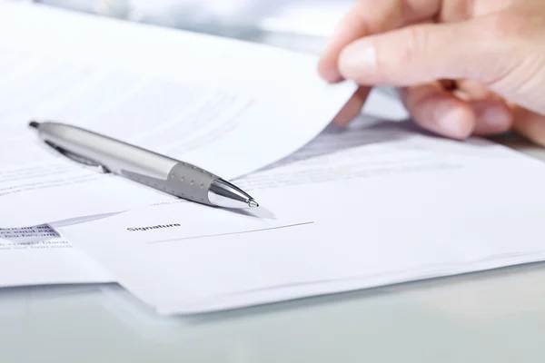 Close-up of a silver pen with documents. — Stock Photo, Image