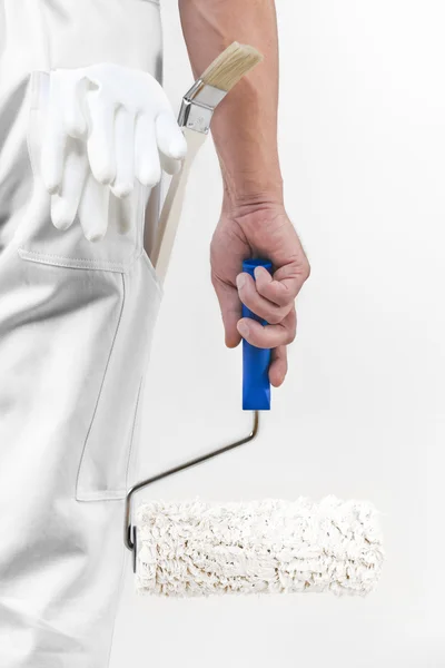 Rear view of painter man with paint roller. — Stock Image Rear view of painter man with paint roller. Stock Image