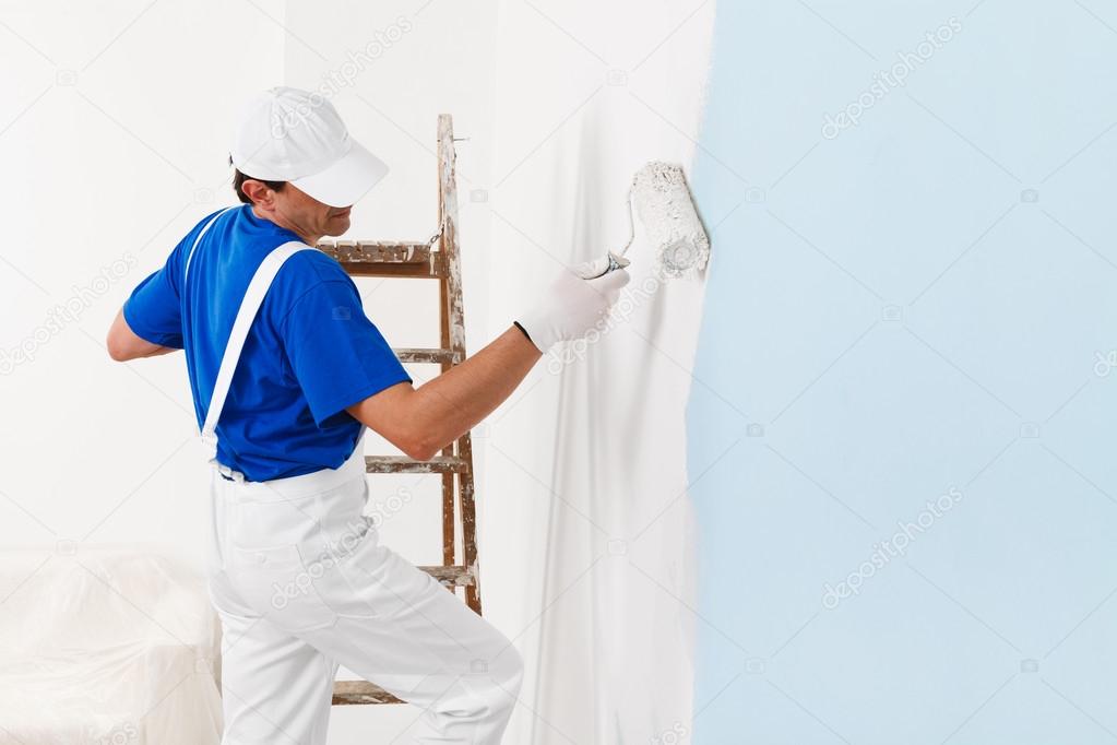 painter painting with paint roller