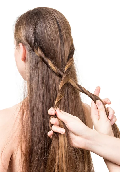 Standing behind the woman doing her hair close up on white — Stock Photo, Image