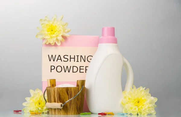 Washing powder and laundry softener on a gray — Stock Photo, Image