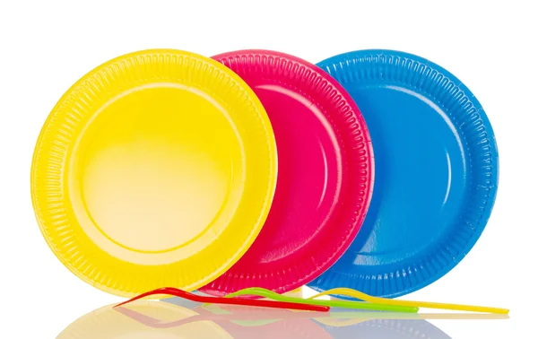 Yellow, pink, blue plastic plates isolated on white — Stock Photo, Image