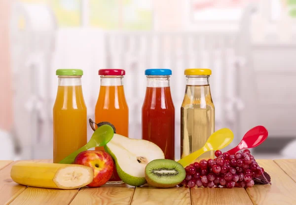 Fresh fruit and  bottle of juice on  background  these dishes. — Stock Photo, Image