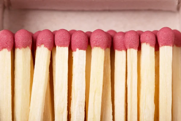 Matches against the backdrop  an open box closeup. — Stock Photo, Image