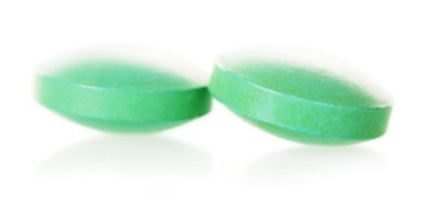 Tıp, yeşil hap yuvarlak şekil üzerinde beyaz izole