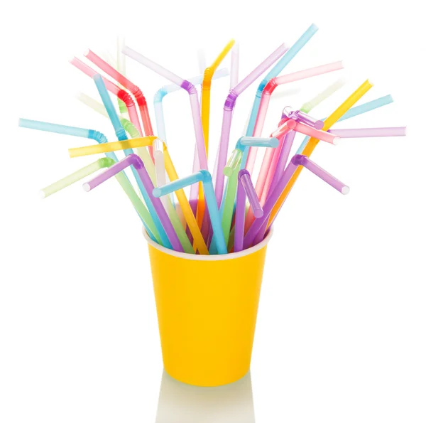 Multi-colored straws for  cocktail in  disposable cup isolated. — Stock Photo, Image