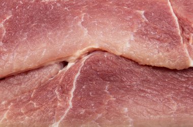 Adet taze çiğ domuz eti yakın çekim. Doku.