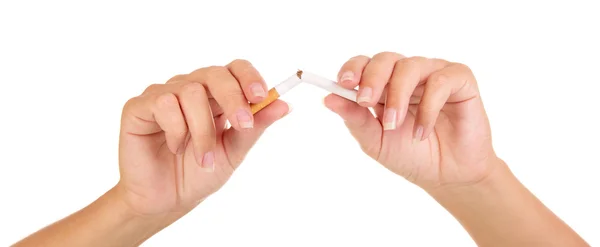 Female hands breaking  cigarette close-up isolated on white background. — Stock Photo, Image