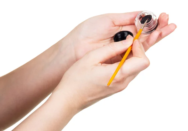 Eye shadows and  brush make-up in female hands isolated. — Stock Photo, Image