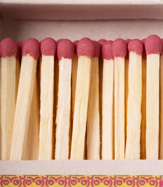 Matches against the backdrop  an open box closeup. — Stock Photo, Image