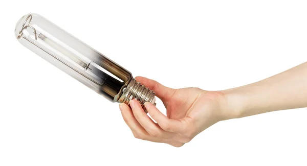 Lámpara de sodio de bajo consumo en mano femenina aislada en blanco . — Foto de Stock
