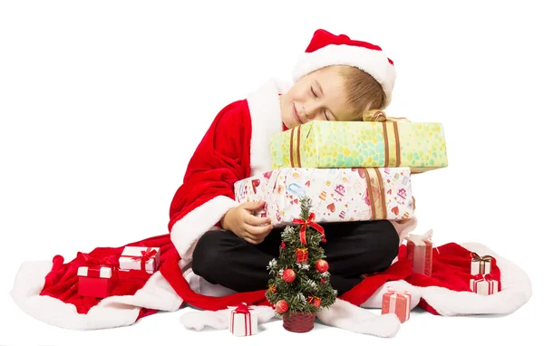 Ładny chłopczyk Mikołaj z pudełeczka na białym tle. — Zdjęcie stockowe