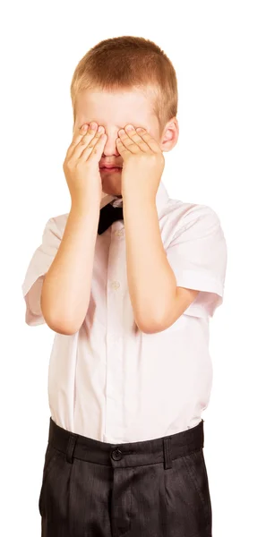 Crying boy covers his face with hands isolated on white. — Stock Photo, Image