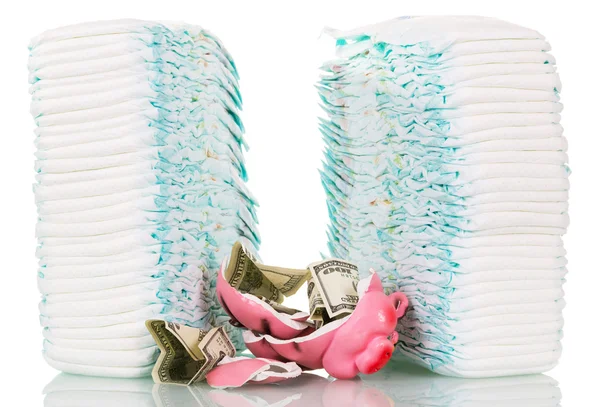 Stacks  childrens disposable diapers, broken piggy bank, money isolated. — Stock Photo, Image