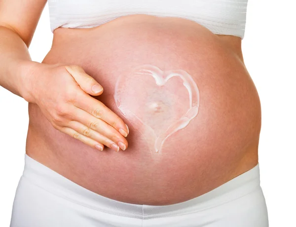 Imagen del corazón en el vientre mujer embarazada aislada . — Foto de Stock