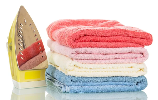 Steam iron and ironed colored towels isolated on white. — Stock Photo, Image