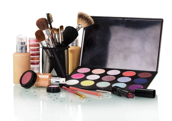 Set of decorative cosmetics and makeup brushes isolated on white. — Stock Photo, Image