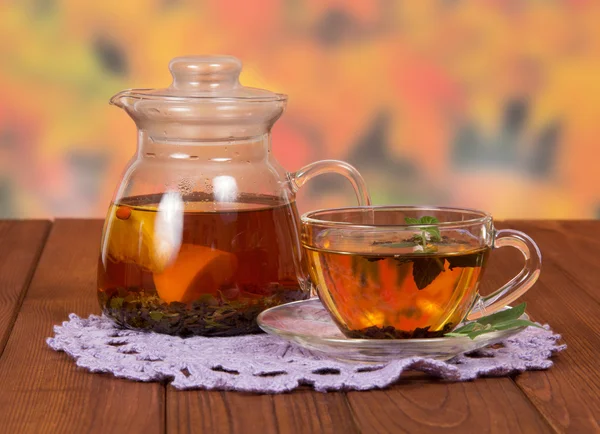 Teapot and a cup of tea — Stock Photo, Image