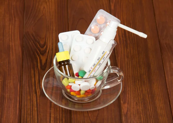 Cup with medicines — Stock Photo, Image