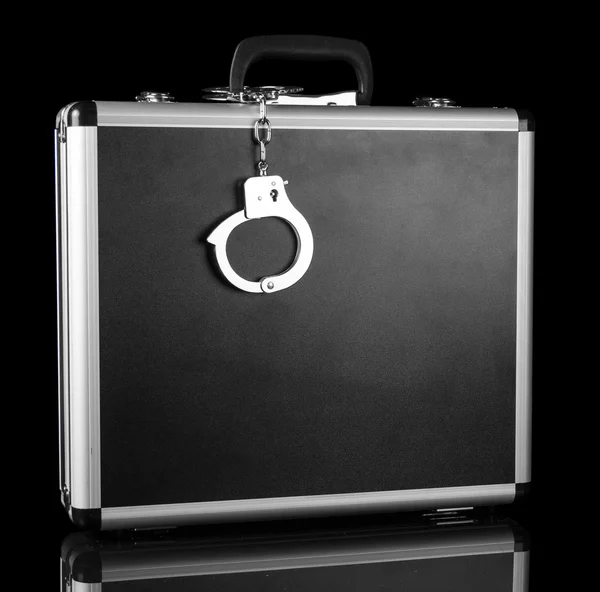 Handcuffs chained to silver case — Stock Photo, Image