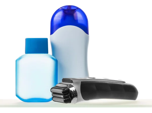 Elektrický holící strojek a krém s deodoranty — Stock fotografie