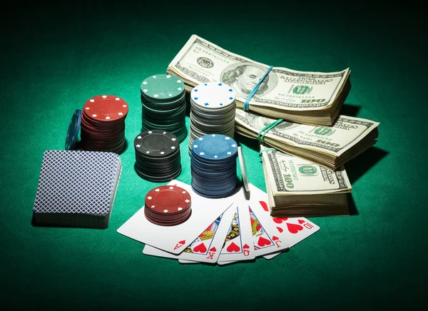 Poker chips and dollar bills — Stock Photo, Image