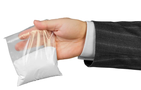 Mão masculina com pacote de drogas — Fotografia de Stock