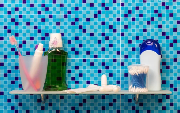 Toothbrushes on bathroom shelf — Stock Photo, Image