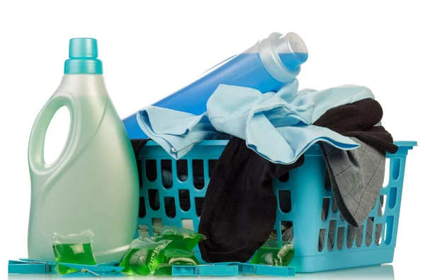 Detergents and clothes in baske — Stock Photo, Image