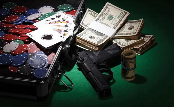 Poker chips and gun — Stock Photo, Image