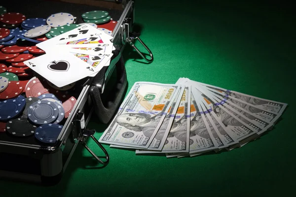 Poker chips and dollar bills — Stock Photo, Image