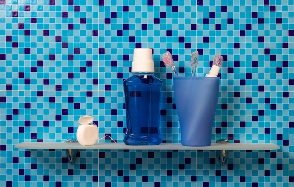 Toothbrushes on bathroom shelf — Stock Photo, Image