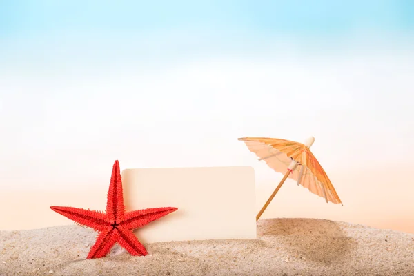 Blank card in sand — Stock Photo, Image