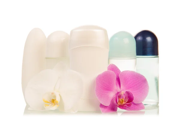 Desodorizantes e flores de orquídeas — Fotografia de Stock
