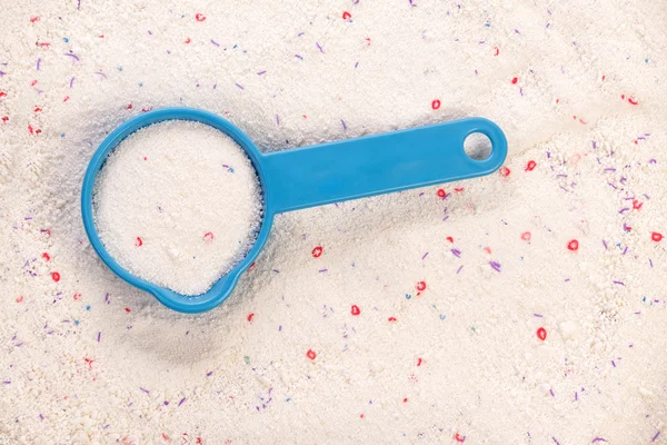 Washing powder in measuring cup — Stock Photo, Image