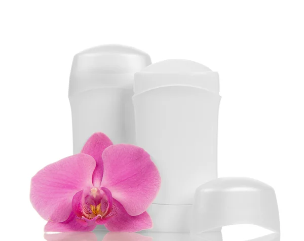 Дезодоранты и цветки орхидей — стоковое фото